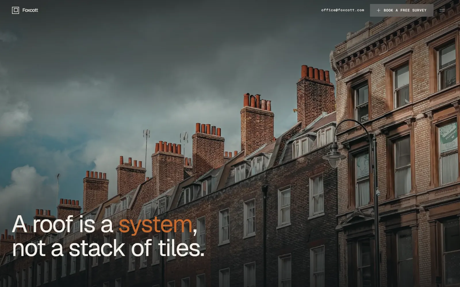 The Foxcott Roofing home page: a stormy photograph of a London terrace roofline behind the headline “A roof is a system, not a stack of tiles.”
